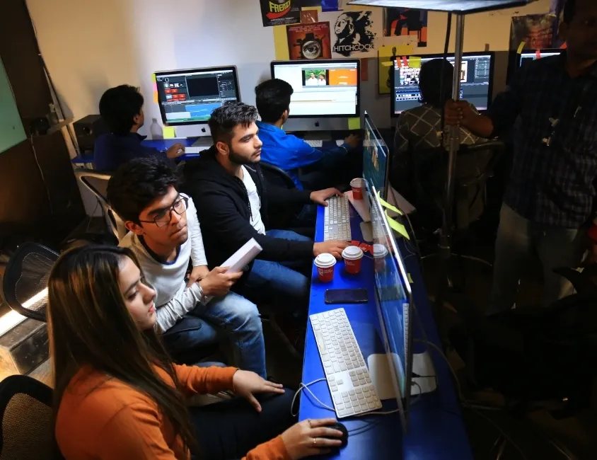 Film editing and post-production lab with editing workstations at AAFT School of Cinema
